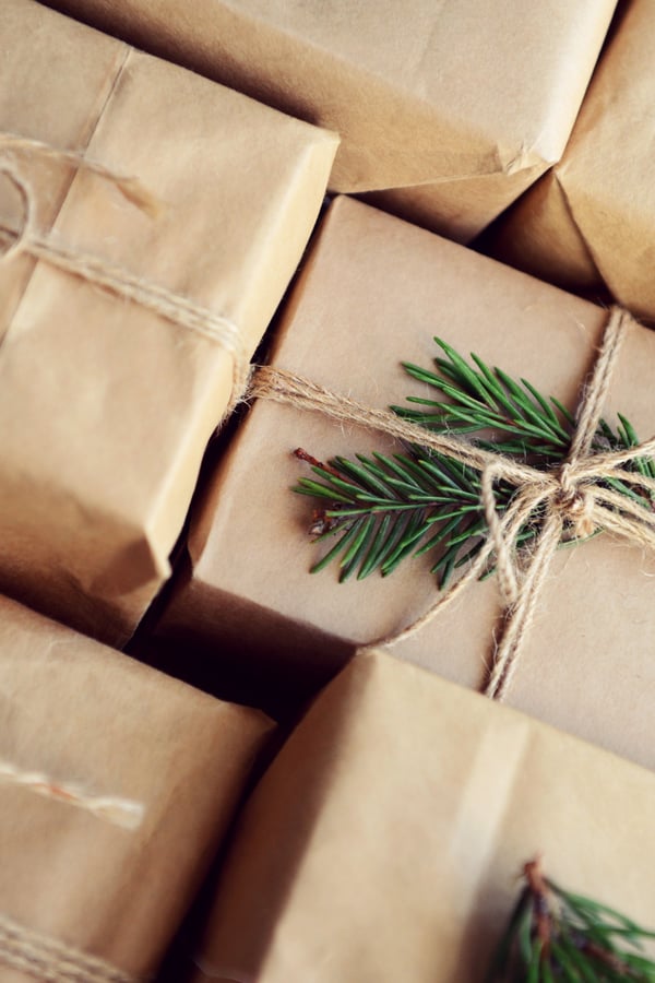 Christmas promotional corporate merch packs wrapped in brown paper 