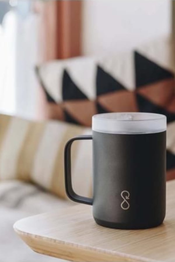The ocean bottle travel coffee cup on a table.
