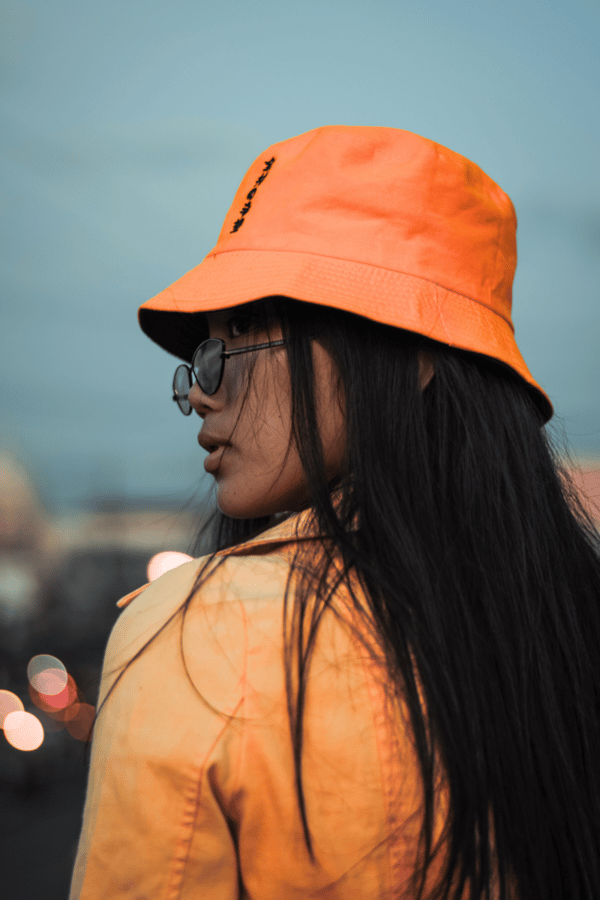 An orange bucket hat. 
