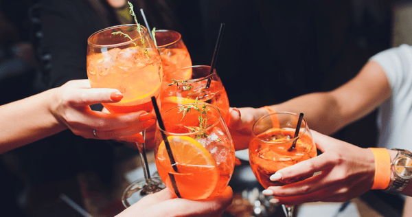 A group of people enjoying Aperol spritz' together 