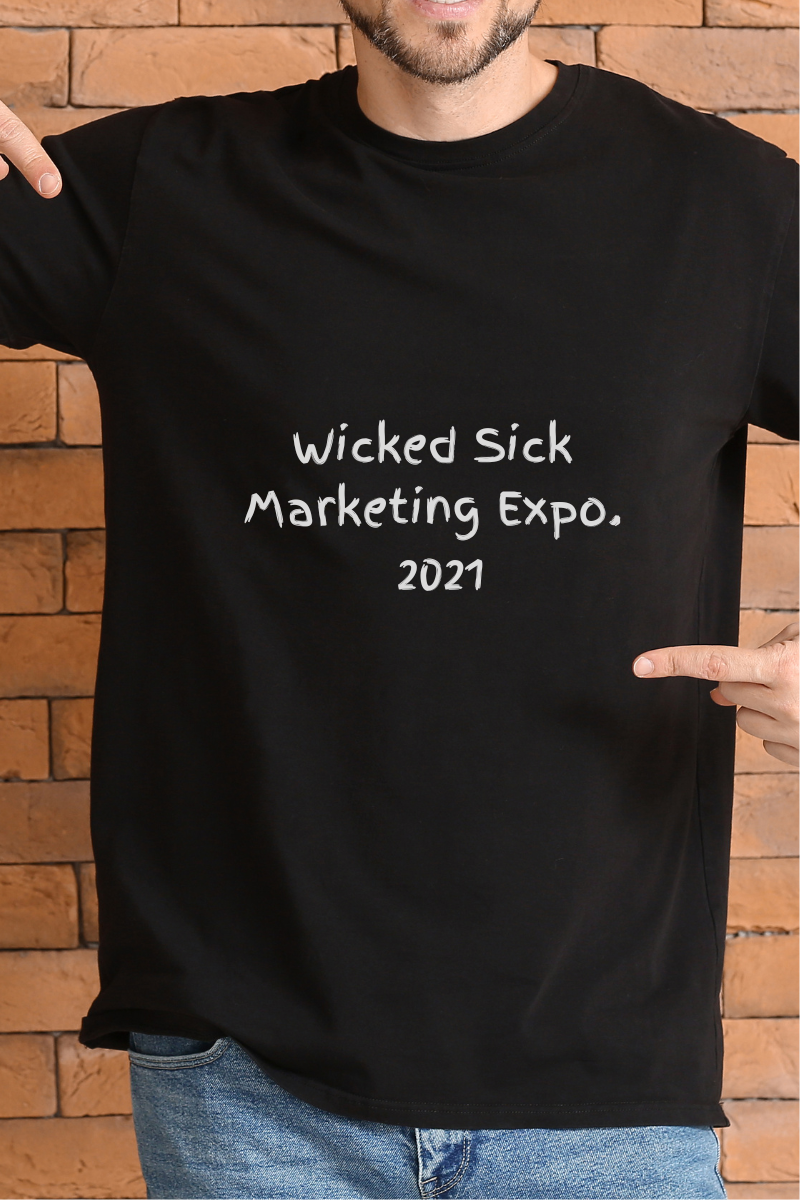 A photo of a man wearing a t-shirt that says, "Wicked Sick Marketing Expo. 2021"