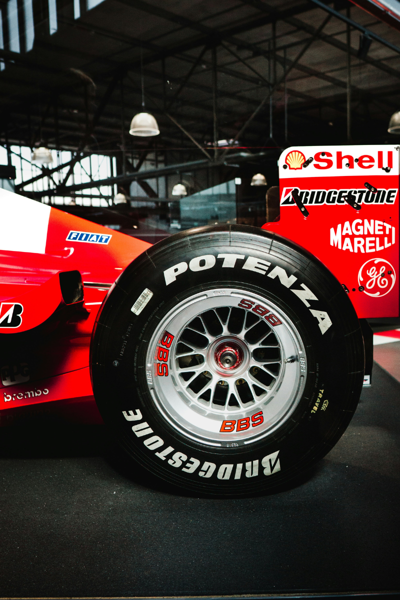 A close-up photo of a wheel on a Ferrari race track car.