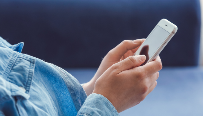 Someone using a phone.