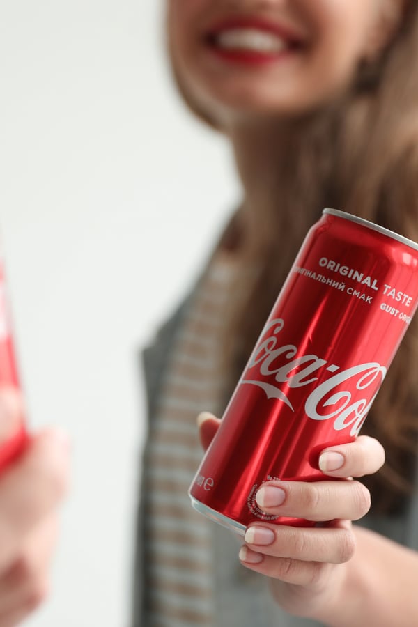 People enjoying Coca Cola together. 