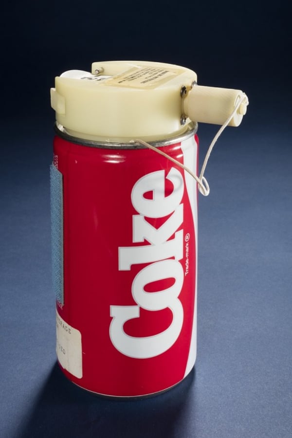 A coke can with a device on it so it could be drunk in space. 