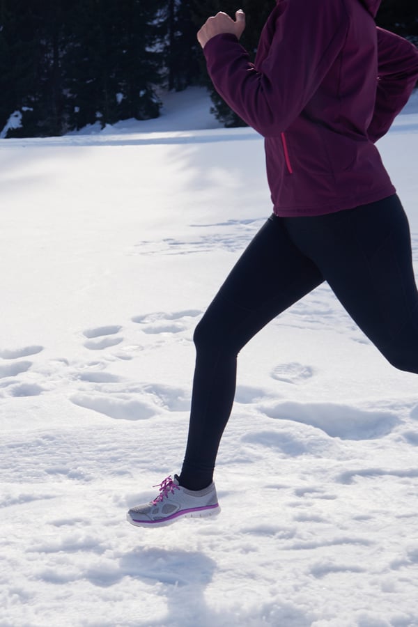 someone running in the snow.