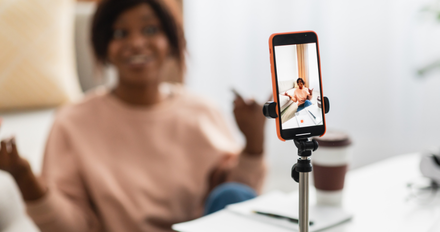 A lady filming TikTok videos. 