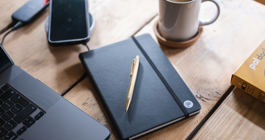 a Power of LIfe notebook on a table