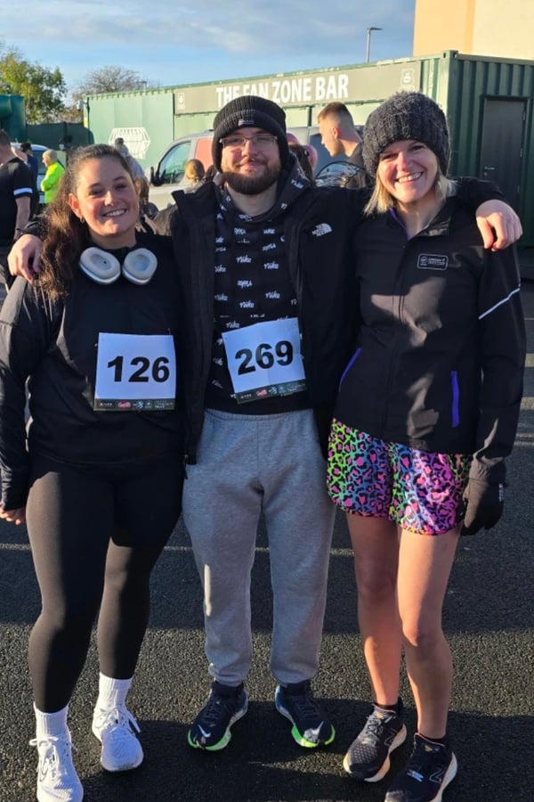 Kate, Hollie and Roy participating in the 2025 Plymouth Argyle Green Army Fun Run