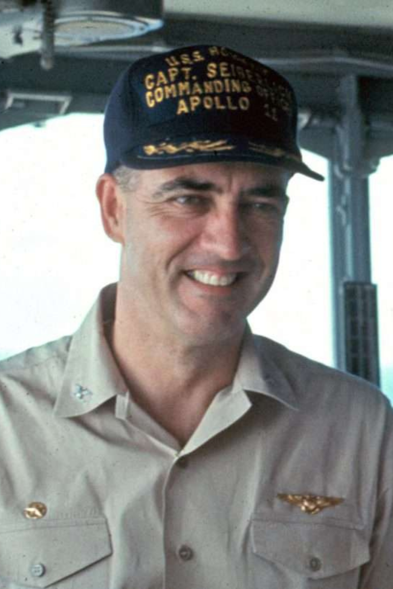 Captain CJ Seiberlich wearing a branded cap upon the U.S.S. Hornet.