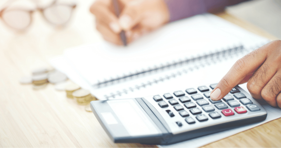 A photo of someone using a calculator to work out their finances.