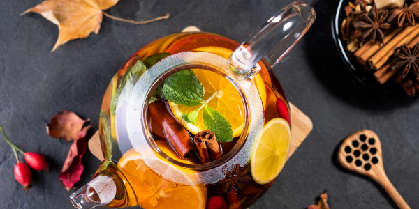 Fruit tea in a glass teapot lifestyle image 