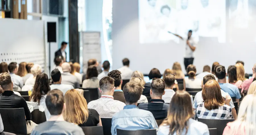 business speaker giving a talk at eco friendly conference event